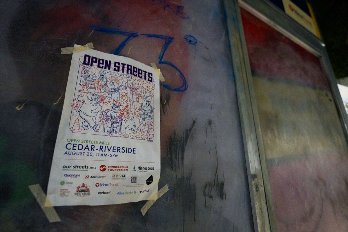 A flyer for Open Streets Cedar-Riverside at a bus stop in South Minneapolis on August 20, 2023.