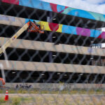 A new mural being painted on the parking garage next to Seven Points Mall at Lake and Girard in Uptown Minneapolis. Winston Smith was killed by law enforcement on June 3, 2021 on the top floor which led to months of protest.
