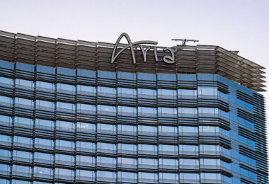 Aria Resort & Casino, which opened in December 2009, is part of the CityCenter development on the Las Vegas Strip. Designed by Pelli Clarke Pelli Architects, the 61-story curved glass tower houses more than 4,000 guest rooms and suites, two pools, and a 150,000-square-foot casino. It was one of the first major resorts in Las Vegas to emphasize sustainability, earning multiple LEED Gold certifications for its energy efficiency and smart room technology. Aria is also known for its understated, modern aesthetic — replacing themed extravagance with clean architecture, high-end dining, and an extensive art collection integrated throughout the property.