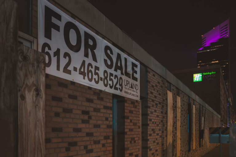 For Sale building in Downtown Minneapolis 2 A Upload Real Estate Group For Sale sign on a building in downtown Minneapolis.