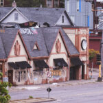 Graffiti covers the windows of long vacant former Rudolphs Bar-B-Que.