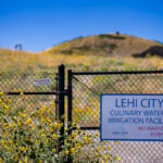 A sign at the gate of the Lehi City Culinary Water & Irrigation Facility in Lehi, Utah.