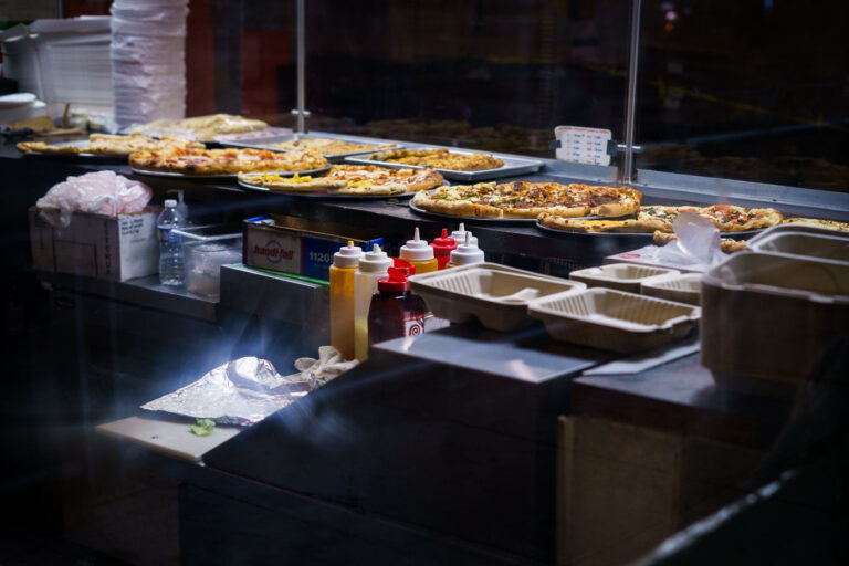 Pizza in the window at Sal's Pizza 3 Pizza at Sal's Pizza on N 5th Street in Downtown Minneapolis.