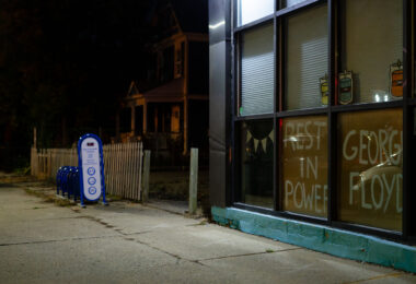 "Rest In Power" and "George Floyd" in a window of a business on Chicago Avenue in South Minneapolis.