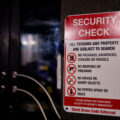 A security check sign outside a bar in downtown Minneapolis.