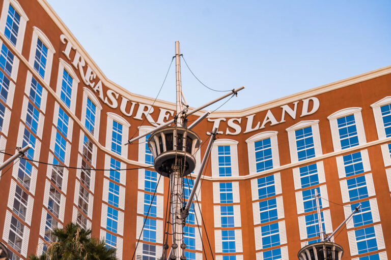 Treasure Island Hotel and Casino in Las Vegas 1 Treasure Island Hotel and Casino, often called “TI,” opened in 1993 on the Las Vegas Strip as a pirate-themed resort developed by Steve Wynn. The property’s signature red and cream façade overlooks a lagoon once home to nightly pirate ship battles—an attraction that became one of the Strip’s most recognizable spectacles. While the resort has evolved over time, moving away from its original family-friendly theme, the nautical elements and ship masts at its entrance remain as nostalgic reminders of its 1990s Las Vegas showmanship.