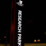 A sign reading "University of Utah" "Research Park" as seen in September 2023 in Salt Lake City, Utah.