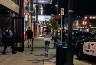 An off duty Minneapolis Police officer works outside Rumba Nightclub on Lake Street in Uptown Minneapolis. October 2023.
