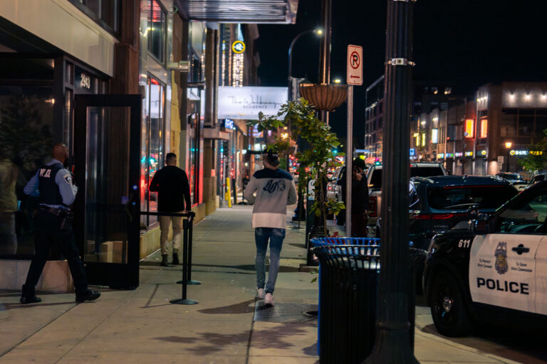 10/21/23 Off duty police at Rumba club 2 An off duty Minneapolis Police officer works outside Rumba Nightclub on Lake Street in Uptown Minneapolis. October 2023.
