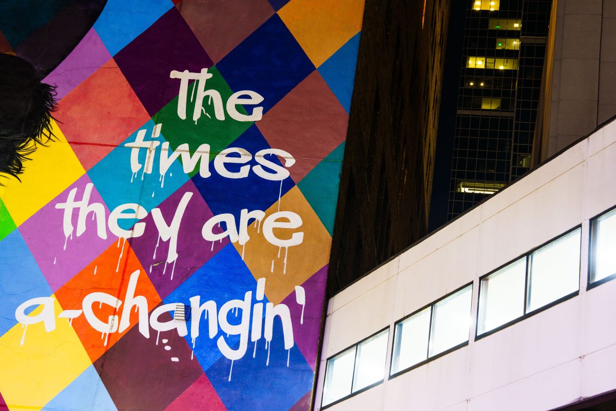 Colorful diamond-patterned mural with Bob Dylan quote in downtown Minneapolis.