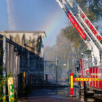 October 20, 2023 - Firefighters continue to pour water on the former temporary post office/k-mart. After two South Minneapolis post offices were burned down in May 2020, the Postal Service leased space in the building from November 2020 to late summer 2023 for temporary post offices during rebuild.