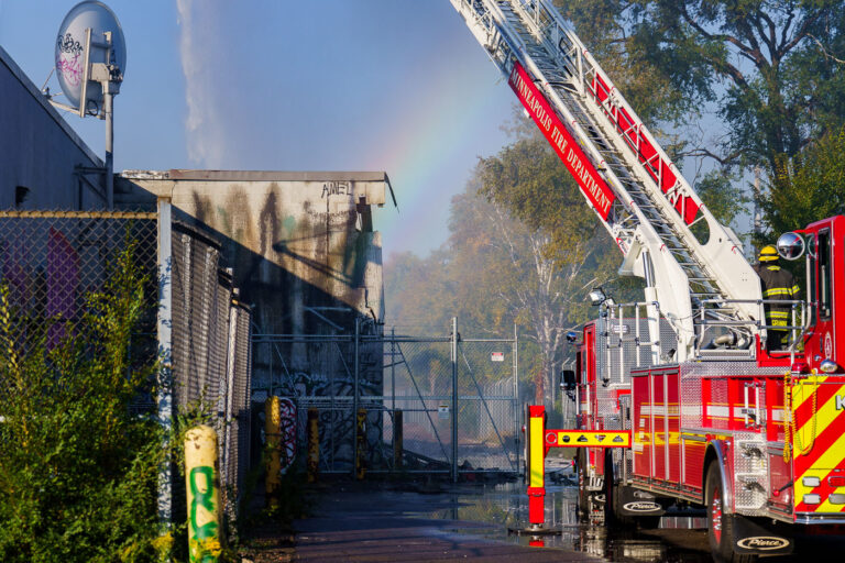 Firefighter puts out a fire at the abandoned K-Mart 4 October 20, 2023 - Firefighters continue to pour water on the former temporary post office/k-mart. After two South Minneapolis post offices were burned down in May 2020, the Postal Service leased space in the building from November 2020 to late summer 2023 for temporary post offices during rebuild.