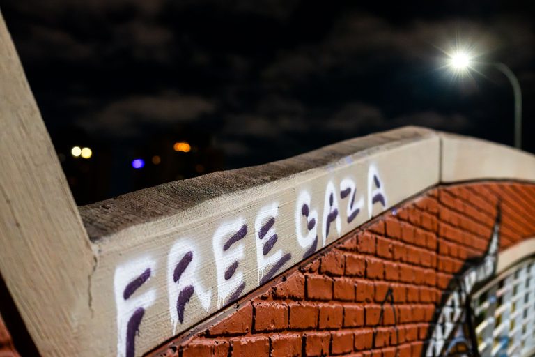 "Free Gaza" Graffiti on Loring Bike Bridge, Minneapolis 4 "Free Gaza" spray-painted text on Loring Bike Bridge in South Minneapolis at night.