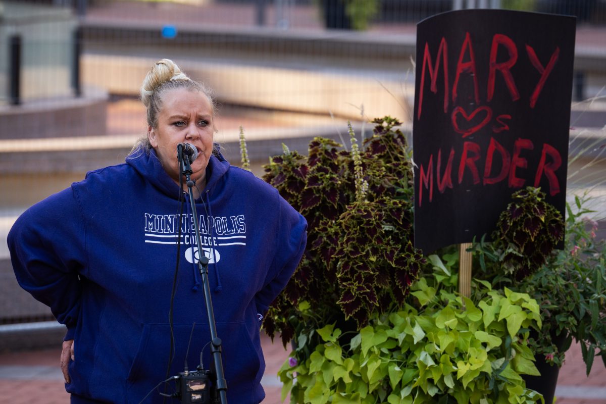 Lacey Gauthier Speaks Beside “Mary Loves Murder” Sign at Rally