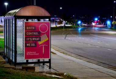 A planned parenthood sign on a bus stop in South Minneapolis. October 2023.