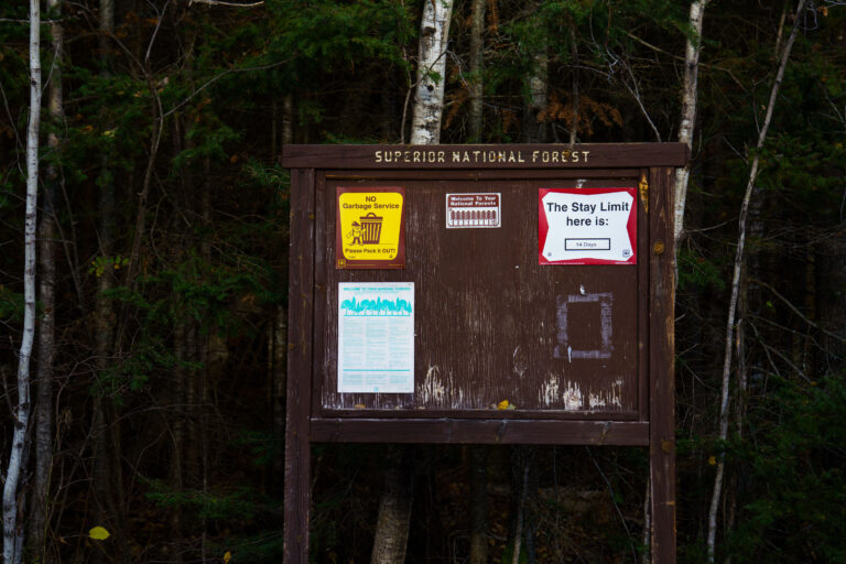 Superior National Forest Sign, Whitefish Lake Campground, MN 2 Superior National Forest sign at Whitefish Lake Campground, MN, displays regulations including 'NO Garbage Service Please Pack it OUT!' and a 14-day stay limit.