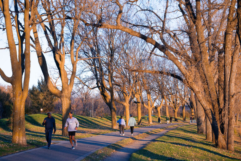 Joggers at Bde Maka Ska in November 2023 2 Bde Maka Ska in Minneapolis on a warm mid November day.