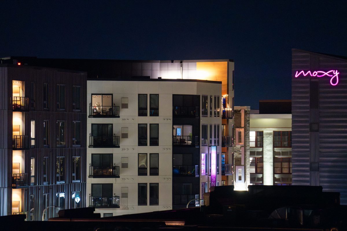 Moxy Hotel illuminated at night on Lake Street in Uptown Minneapolis.