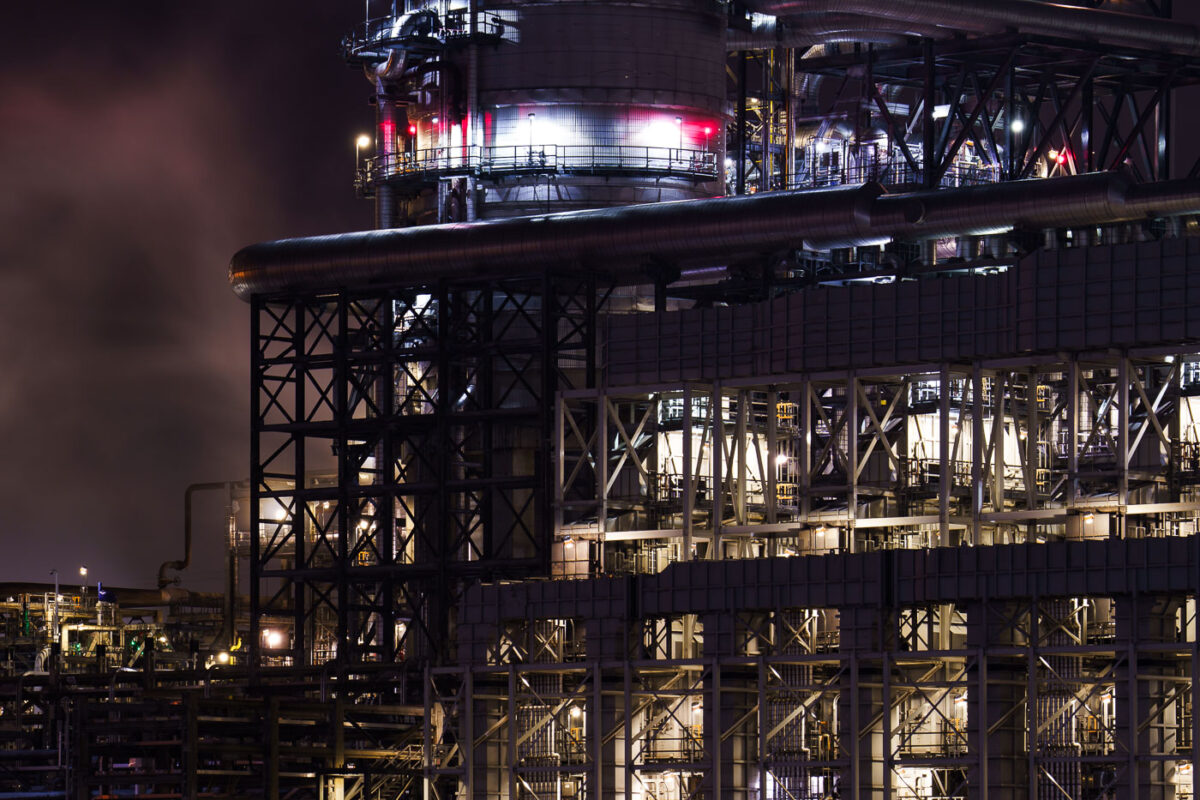 BP Whiting Refinery in Indiana operates at night, showcasing illuminated industrial structures and complex pipework. It is the largest oil refinery in the Midwest and BP's largest globally.