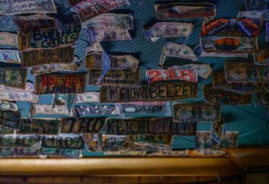 Dollar bills taped to the walls at Cuzzy's Bar in downtown Minneapolis.