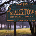 Welcome to Marktown, Indiana. Marktown is on the National Register of Historic Places.The town was created by Clayton Mark, owner of the Clayton Mark and Company that made steel pipes, to house employees. The town is bordered by a US Steel plant and the largest BP refinery in the world. The town is known as the only town in North America where residents drive on the sidewalks and walk in the street.