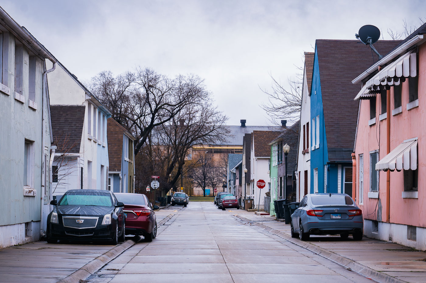 Liberty Street in Marktown, Indiana, a historic residential area built for steelworkers, with colorful homes and elevated sidewalks.