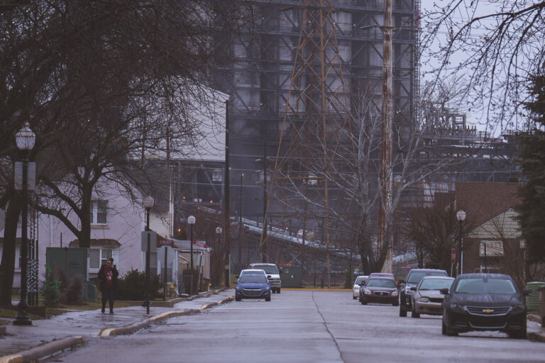 Marktown Street View with BP Refinery in East Chicago, Indiana 3 Residential homes in Marktown, East Chicago, Indiana, are situated near the BP refinery, a major industrial site in the Indiana Harbor area.