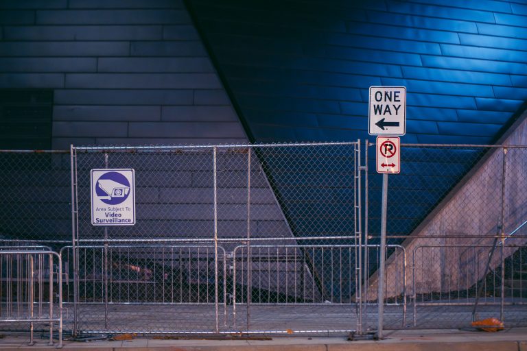 Perimeter Fencing at US Bank Stadium, Minneapolis 2 Chain-link fencing secured with a "One Way" directional sign and video surveillance notice at US Bank Stadium in Minneapolis.
