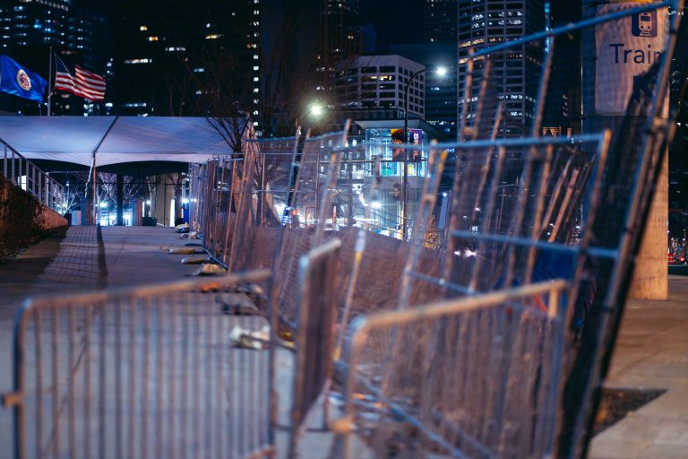 Security Fencing Near US Bank Stadium, Minneapolis 1 Chain-link fencing surrounds US Bank Stadium in downtown Minneapolis at night.
