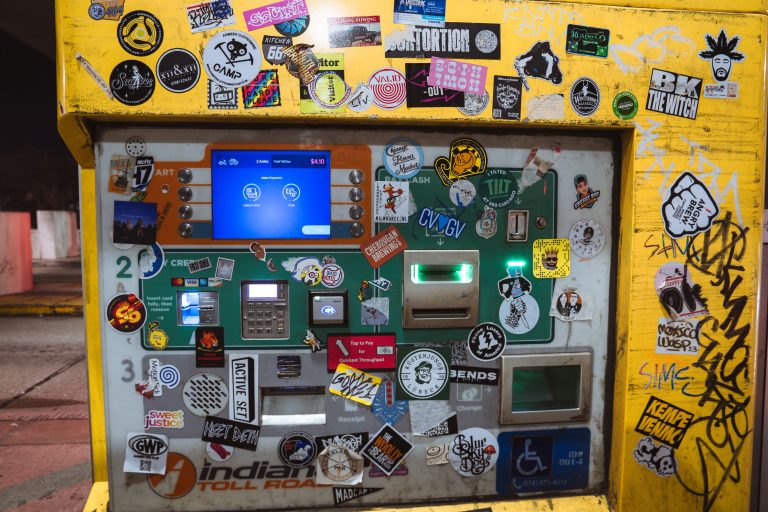 Sticker-Covered Toll Booth, Indiana Toll Road (I-90) 2 Yellow toll booth covered with stickers and graffiti at Westpoint Toll Plaza on Interstate 90 in Indiana.