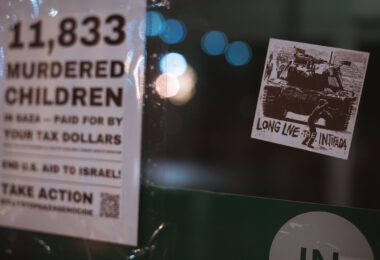 A sticker reading "Long live the intifada" on a Uptown Minneapolis storefront. January 2024.