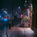 Night photo of wet sidewalk with rain January 24