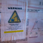 Flyers on the Martin Olav Sabo Bridge in South Minneapolis. Located a quarter mile quarter mile from the replacement 3rd precinct/"community safety center". After signing the purchase agreement last week, the city says the new building could be open in Q1 of 2025 - 5 years after it was burned. (Minneapolis, February 2024)