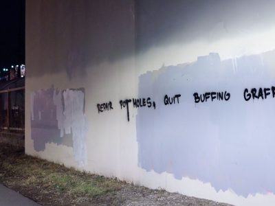 'Repair Potholes, Quit Buffing Graff' Along the Midtown Greenway