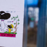 Flyer of Snoopy saying "We'll do it again" and "No New Precinct" seen on the Midtown Greenway in Minneapolis. Flyers are in protest of a new Minneapolis police police station rebuild after protesters burned the previous one on May 28th, 2020.