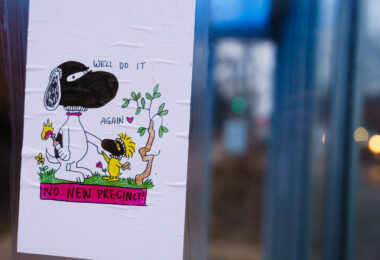 Flyer of Snoopy saying "We'll do it again" and "No New Precinct" seen on the Midtown Greenway in Minneapolis. Flyers are in protest of a new Minneapolis police police station rebuild after protesters burned the previous one on May 28th, 2020.