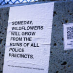 Someday, Wildflowers Will Grow 1 Flyers seen around the third precinct in South Minneapolis protesting the building of a replacement Minneapolis Police Third Precinct. Flyer reading "Someday, wildflowers will grow from the ruins of all police precincts".