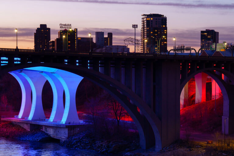 10th Avenue and 35W Bridges 4 The 10th Avenue and I-35W bridges lit up at sunset near downtown Minneapolis. March 2024.