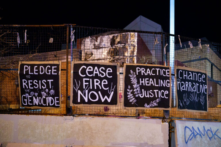 Ceasefire now signs on former 3rd precinct 1 Posters hang from the former Minneapolis police third precinct. The precinct was abandoned after it was burned in May 2020 following the murder of George Floyd. It has sat untouched ever since.