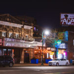 LynLake Brewery and a billboard tagged ACAB on Lyndale Avenue in Minneapolis. March 2024.
