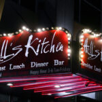 The lit up Hell's Kitchen sign on 9th Street in downtown Minneapolis.