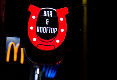 Daisys Bar & Rooftop sign on Hennepin Avenue in front of the McDonalds. The bar replaced another cowboy themed bar "Cowboy Slims".