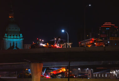 Trucks doing snow removal on Interstate 394 near downtown Minneapolis.