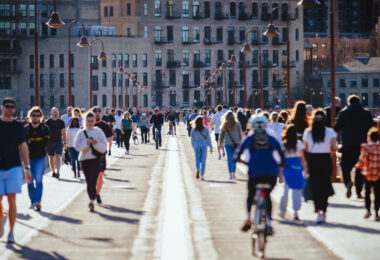 People on the Stone Arch Bridge in downtown Minneapolis on a beautiful March 2024 day.