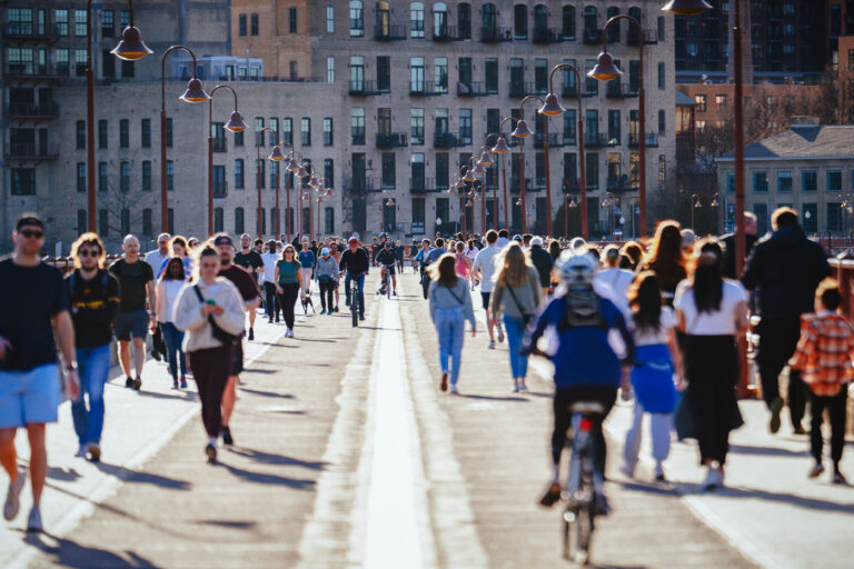 Stone Arch Bridge with people 1 People on the Stone Arch Bridge in downtown Minneapolis on a beautiful March 2024 day.