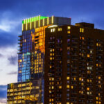 RBC Gateway and The Churchill towers in Downtown Minneapolis. Reflections from Wells Fargo Tower on the side of RBC Gateway during sunset.
