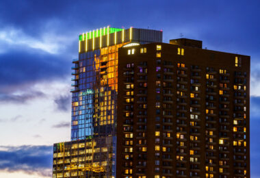 RBC Gateway and The Churchill towers in Downtown Minneapolis. Reflections from Wells Fargo Tower on the side of RBC Gateway during sunset.