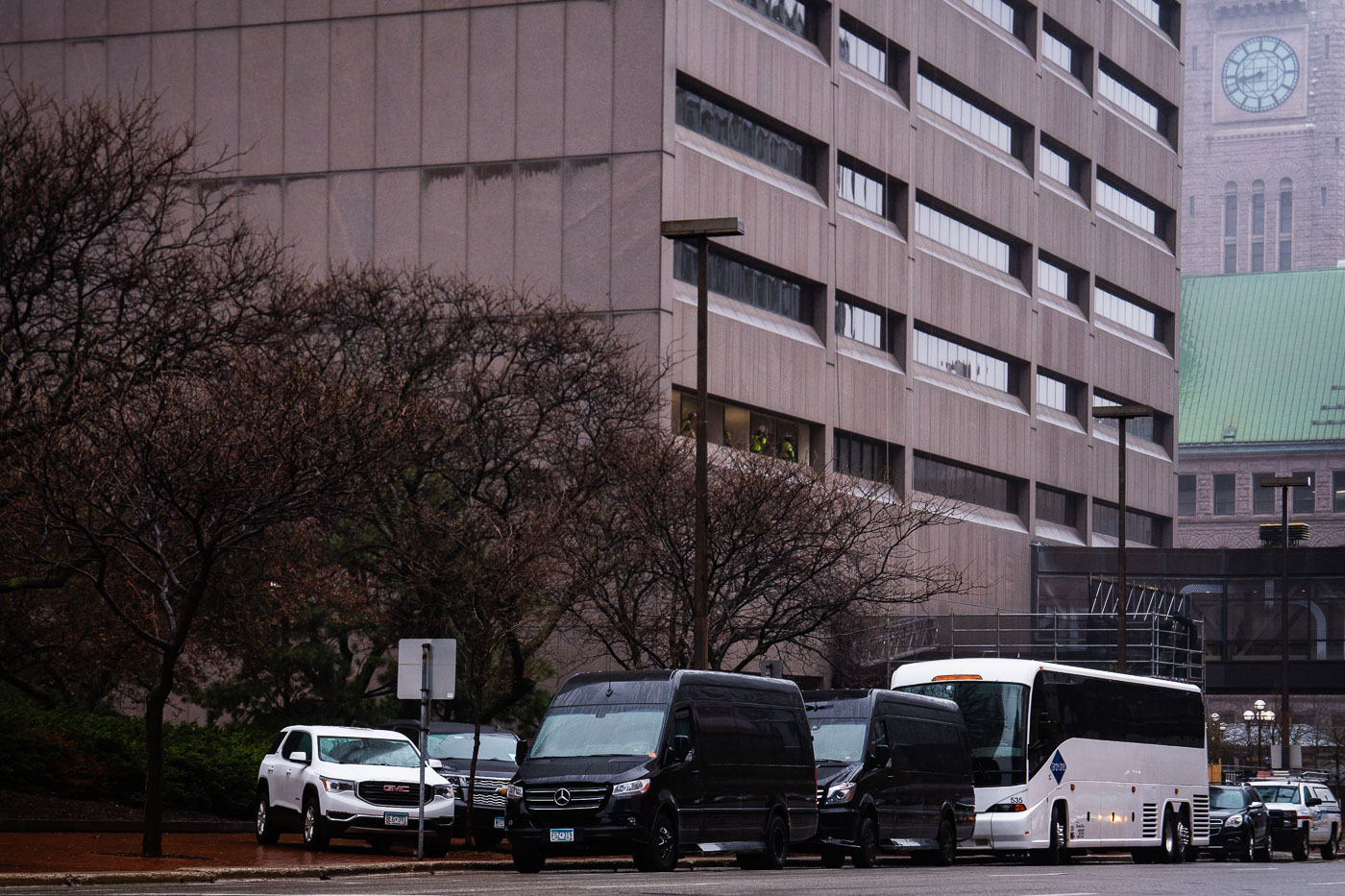 Buses line the street outside court hearing