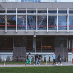 Students walk by the Cabot Science Library on the Harvard University Campus.