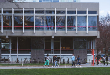 Students walk by the Cabot Science Library on the Harvard University Campus.